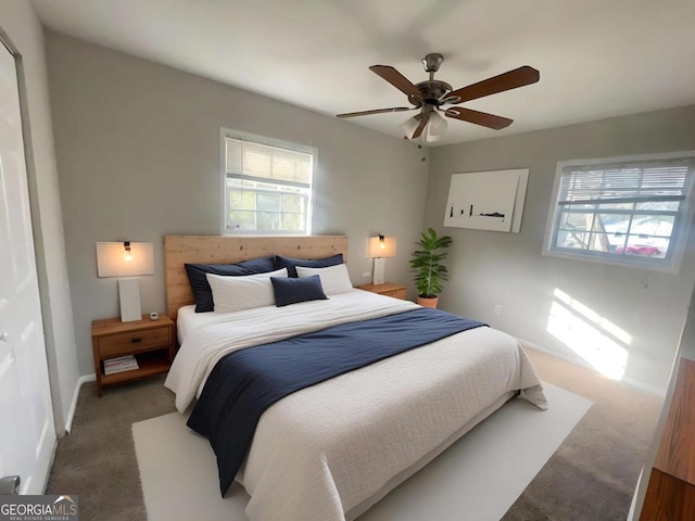 carpeted bedroom with ceiling fan