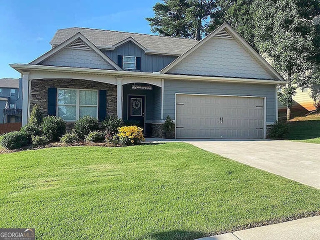 view of front of house with a garage and a front yard