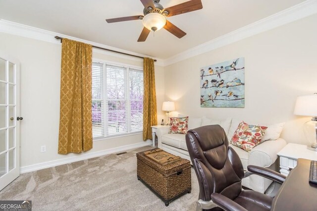 carpeted office with ornamental molding and ceiling fan