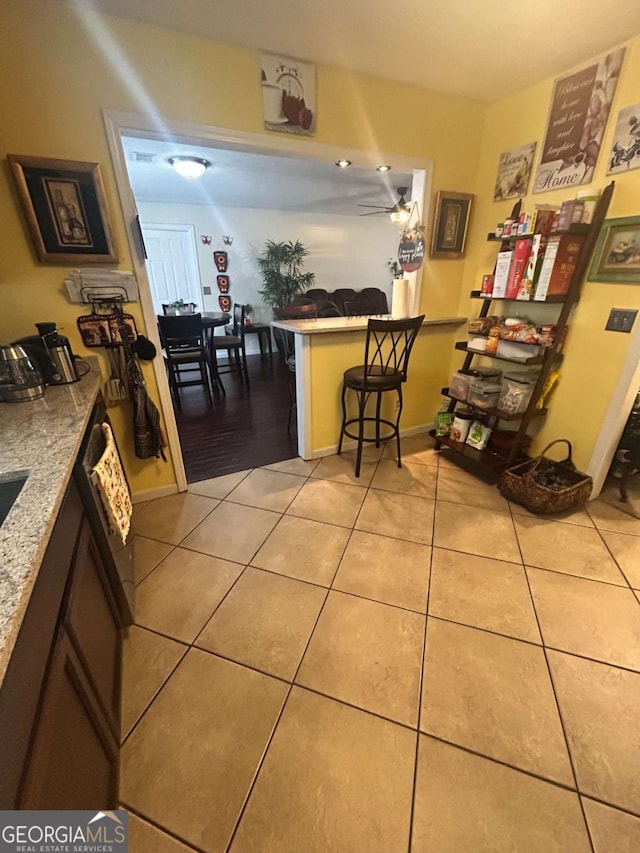 kitchen with light tile patterned flooring