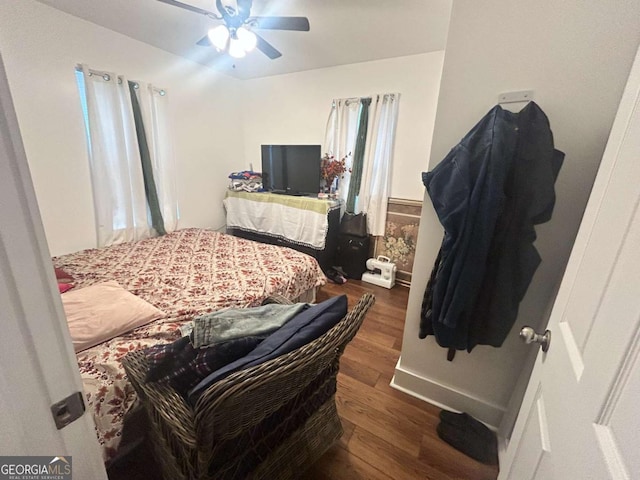 bedroom featuring dark hardwood / wood-style floors and ceiling fan