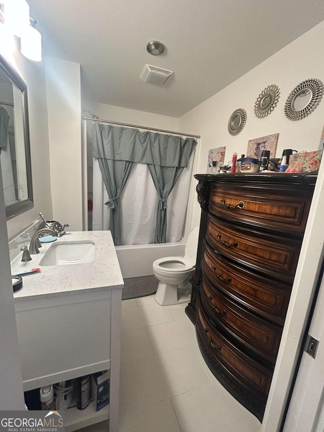 full bathroom with shower / tub combo, vanity, tile patterned floors, and toilet