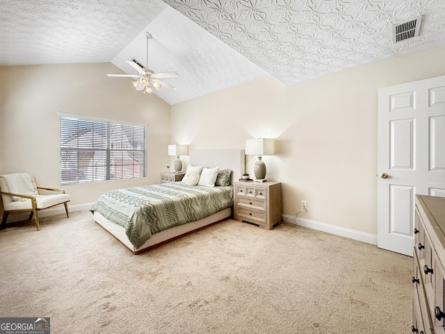 bedroom with visible vents, light carpet, vaulted ceiling, a textured ceiling, and baseboards