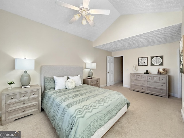 bedroom featuring lofted ceiling, a textured ceiling, light colored carpet, a ceiling fan, and baseboards