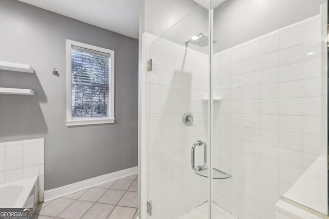 bathroom featuring shower with separate bathtub and tile patterned floors