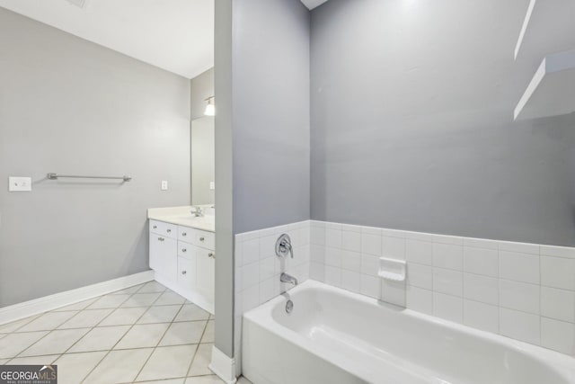 bathroom featuring vanity, a bathtub, and tile patterned floors