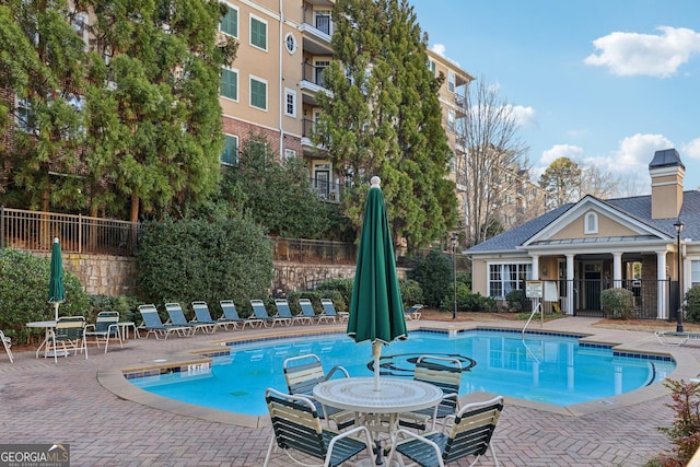 view of swimming pool with a patio area