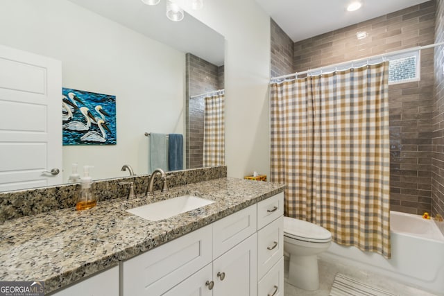 full bathroom featuring vanity, shower / bath combination with curtain, and toilet