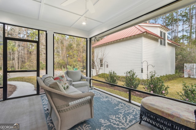 sunroom featuring ceiling fan