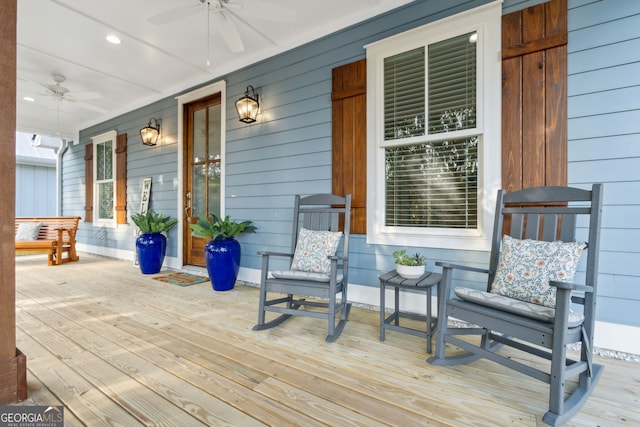 wooden deck featuring ceiling fan and a porch