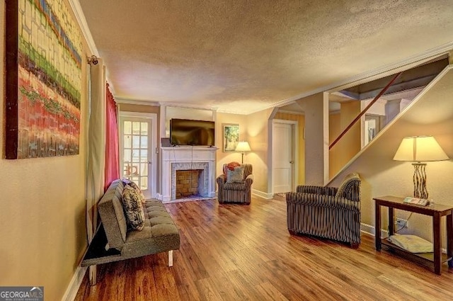 living room featuring hardwood / wood-style flooring and a textured ceiling