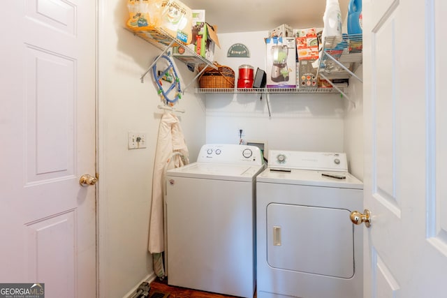 laundry room with independent washer and dryer