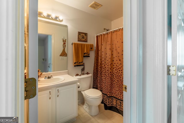 bathroom with vanity, a shower with shower curtain, tile patterned floors, and toilet