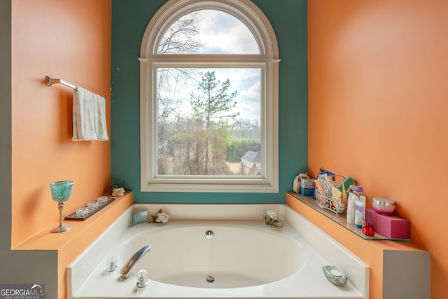 bathroom with a tub to relax in