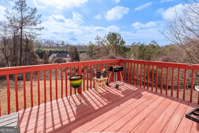 wooden deck featuring grilling area