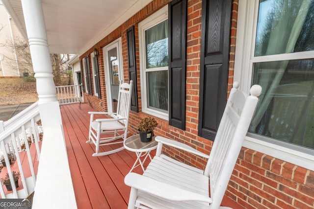 wooden terrace featuring a porch