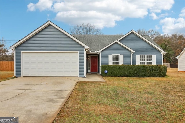 ranch-style house featuring a garage and a front lawn