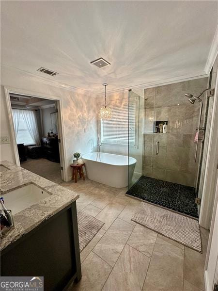 bathroom featuring ornamental molding, vanity, and plus walk in shower