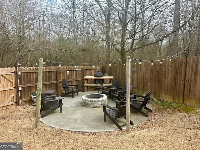 view of patio / terrace featuring an outdoor fire pit