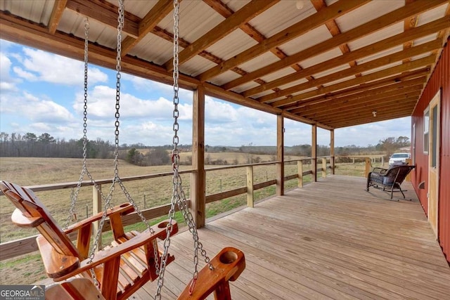 wooden terrace featuring a rural view