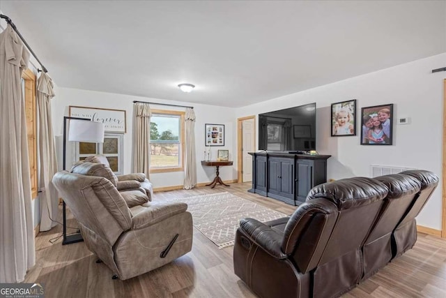 living room with light wood-type flooring