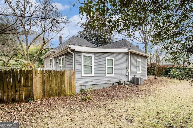 view of side of home featuring central AC unit