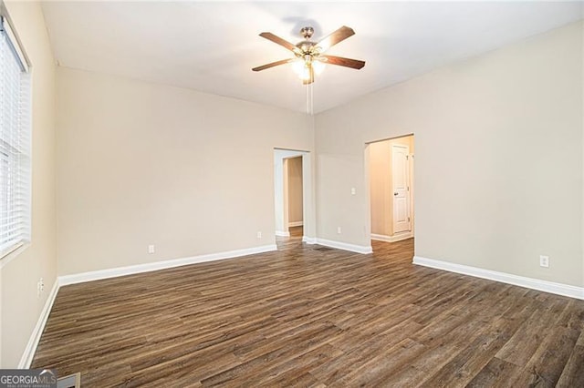 unfurnished room with dark wood-type flooring and ceiling fan