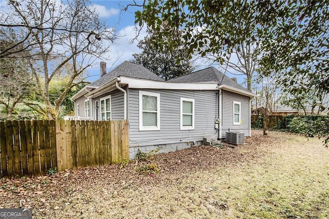 view of side of property featuring central AC unit