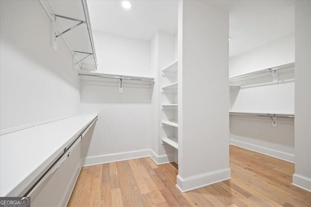 walk in closet featuring light wood-type flooring