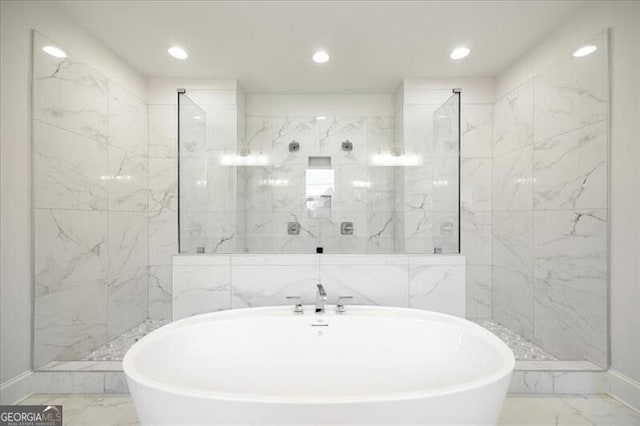 bathroom featuring separate shower and tub