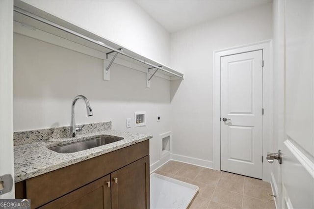 washroom with sink, cabinets, light tile patterned floors, hookup for a washing machine, and electric dryer hookup