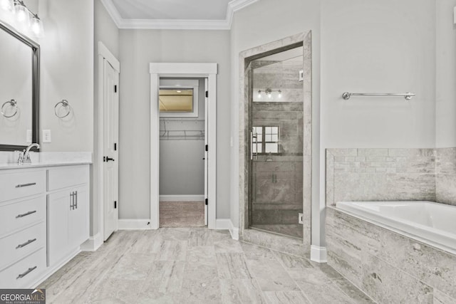 bathroom with vanity, ornamental molding, and separate shower and tub