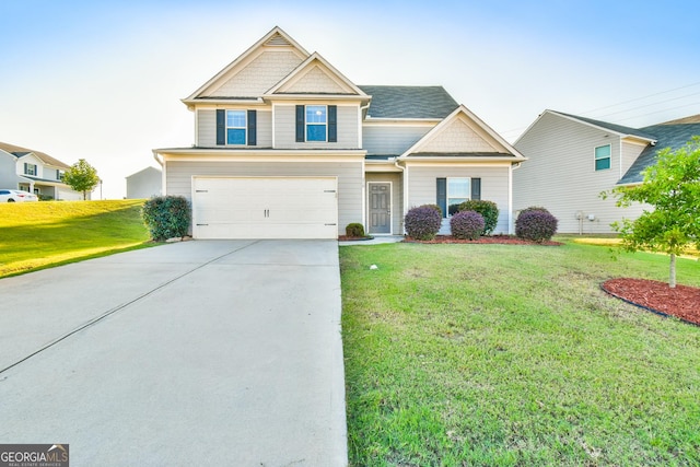 view of front facade featuring a garage and a front yard