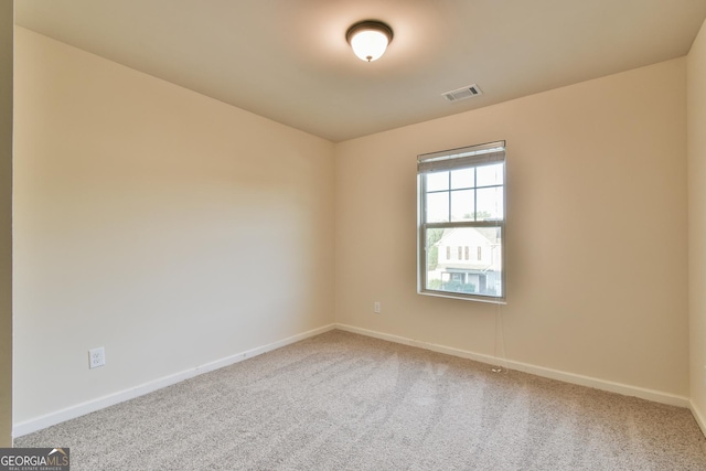 empty room with carpet flooring