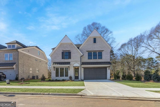 view of front of home with a garage, central air condition unit, and a front lawn