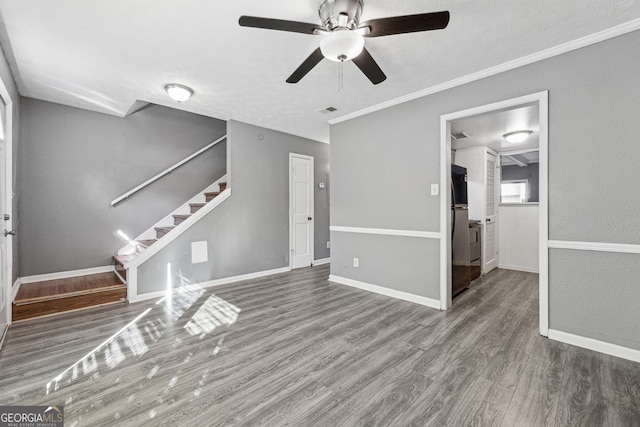 unfurnished living room with crown molding, wood-type flooring, and ceiling fan