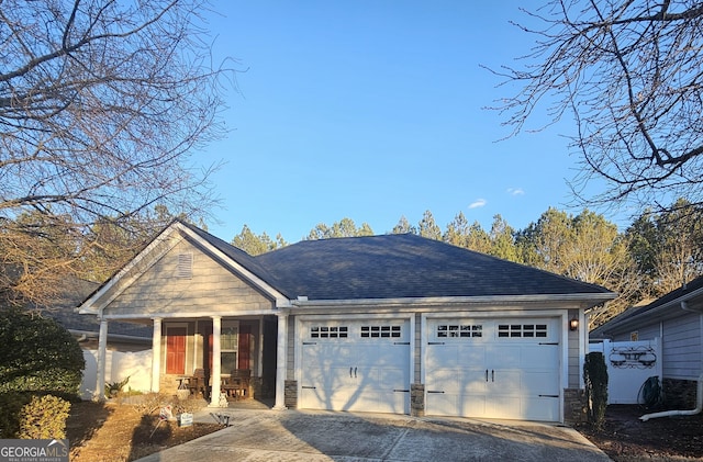 view of front of property featuring a garage and covered porch