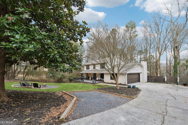 view of front of home with a garage and a front lawn