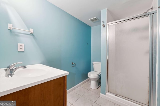 bathroom featuring tile patterned flooring, an enclosed shower, vanity, and toilet