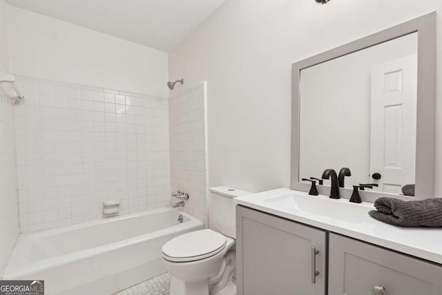 full bathroom featuring vanity, tiled shower / bath combo, tile patterned floors, and toilet