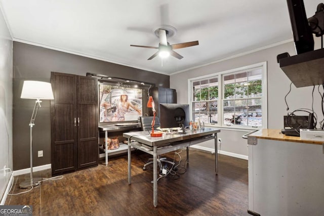 office featuring dark wood-type flooring, ornamental molding, and ceiling fan