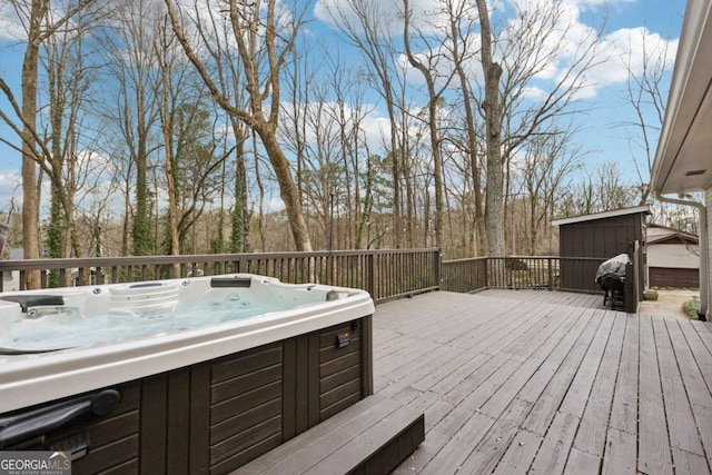 wooden deck featuring a hot tub