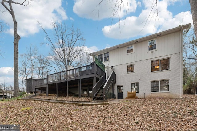 back of house featuring a deck