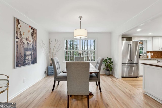 dining room with light wood-type flooring