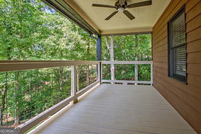 wooden deck with ceiling fan