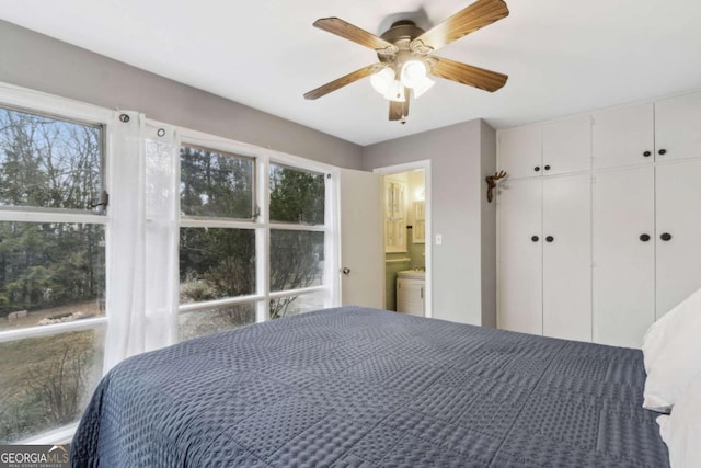 bedroom with ceiling fan and a closet