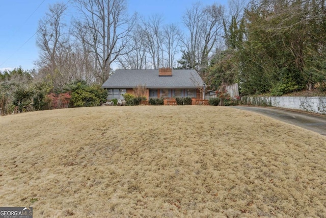 view of front of house featuring a front yard and covered porch