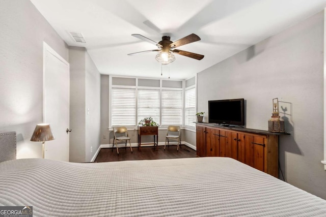 bedroom with dark wood-type flooring and ceiling fan