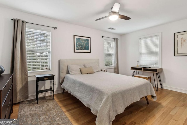 bedroom featuring ceiling fan and light hardwood / wood-style floors