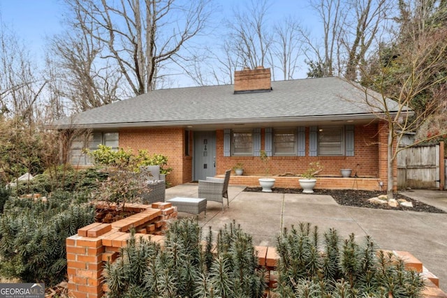 view of front of property featuring an outdoor hangout area and a patio